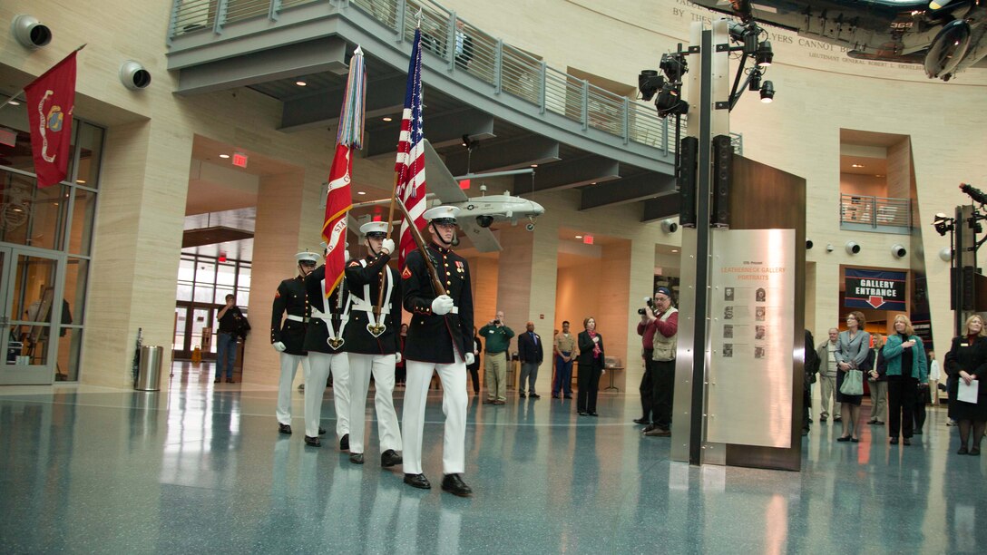 Marines performing color guard march with the colors at the National Museum of the Marine Corps in Triangle, Virginia, March 27, 2015. A ceremony was held at the museum initating the construction of an expansion to the site that will update the museum on the Marine Corps history during the Post-Vietnam War era.