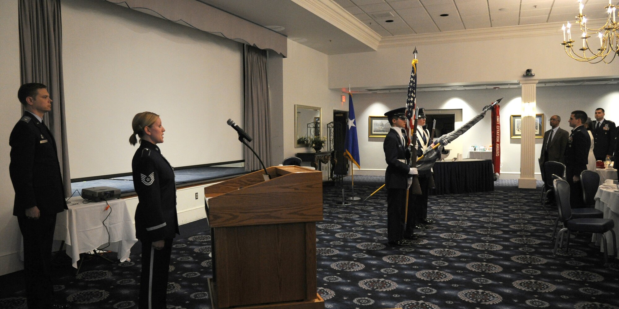 Tech. Sgt. Mandi Harper sings the National Anthem during the Civil Air Patrol National Capital Wing’s 2015 Wing Conference and Banquet at Joint Base Anacostia-Bolling, D.C., March 27, 2015. Harper is a soprano vocalist with The United States Air Force Band’s ensemble Singing Sergeants. The NATCAPWG members provide services to the District of Columbia and the Nation in three mission areas – emergency services, aerospace education, and cadet programs. (U.S. Air Force photo/Master Sgt. Tammie Moore)