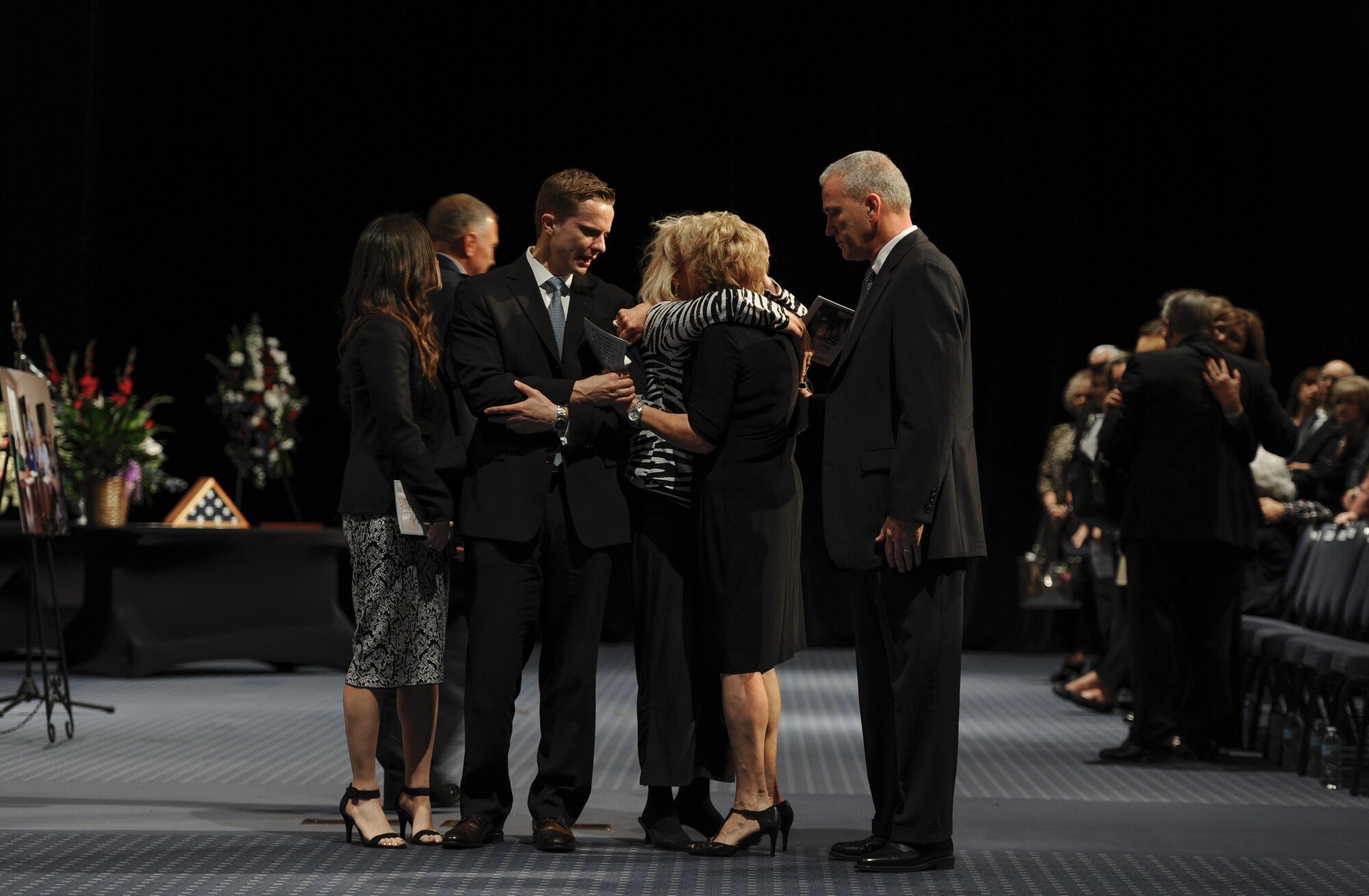 Family members of Chief Master Sgt. of the Air Force #9 James C. Binnicker mourn during his celebration of life ceremony at the Emerald Convention Center, Fort Walton Beach, Fla., March 28, 2015. During his tenure as the ninth chief master sergeant of the Air Force, Binnicker led the transformation from the Airman Performance Report to the Enlisted Performance Report, and developed the performance feedback system. He also worked to have master sergeants admitted to the Air Force Senior NCO Academy, and to increase the opportunities for minorities and women throughout the Air Force. (U.S. Air Force photo/Senior Airman Christopher Callaway)

