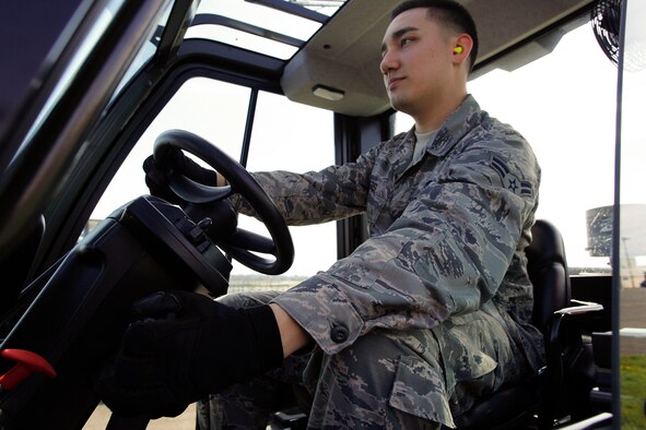 Airman 1st Class Will Akers, 86th Aerial Port Squadron cargo specialist, prepares to operate a 10K forklift March 27 as part of his air transportation specialist on-the-job-training requirements. The 10K forklift is one of the primary pieces of equipment used by air transportation specialists.(U.S. Air Force Reserve photo by Jake Chappelle)
