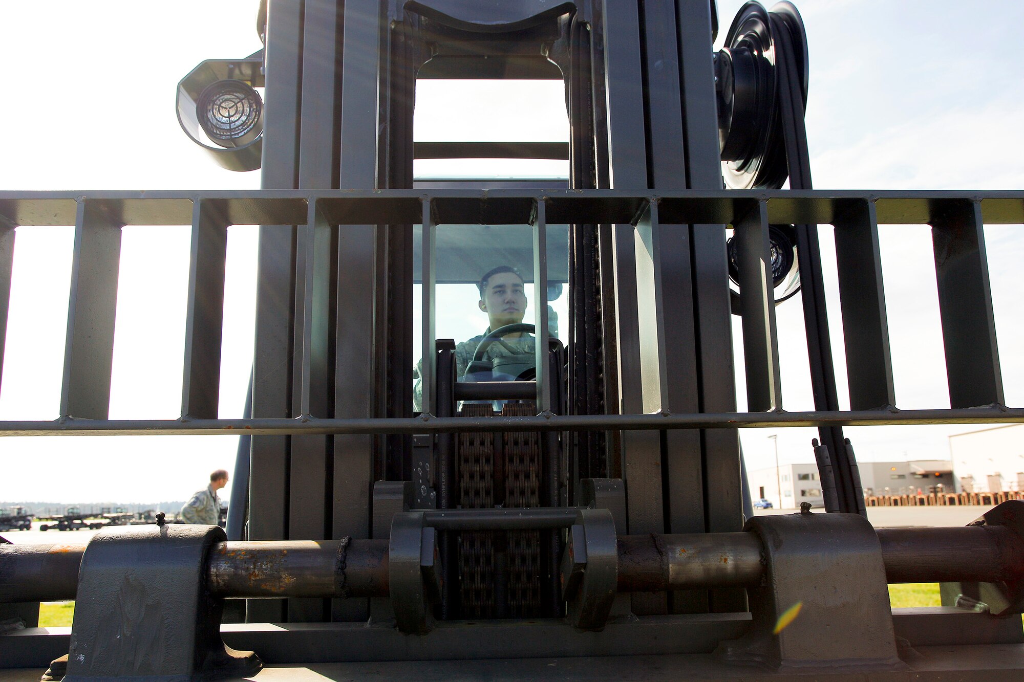 Airman 1st Class Will Akers, 86th Aerial Port Squadron cargo specialist, prepares to operate a 10K forklift March 27 as part of his air transportation specialist on-the-job-training requirements. The 10K forklift is one of the primary pieces of equipment used by air transportation specialists.(U.S. Air Force Reserve photo by Jake Chappelle)