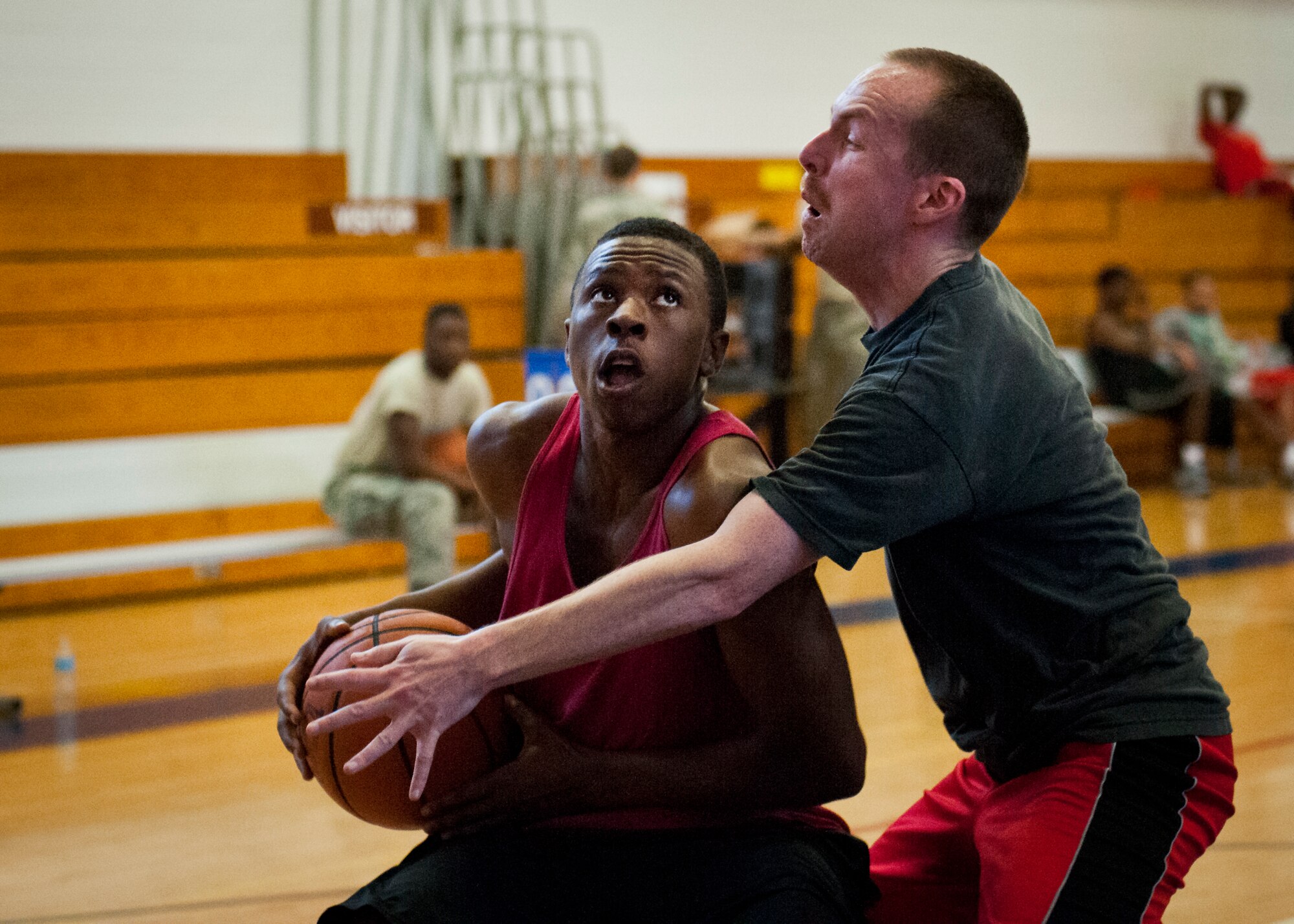 A competitor keeps his eyes on the goal as he goes up for a shot during a three-on-three tournament held March 20 at Eglin Air Force Base, Fla. A variety of teams battled it out in the double elimination contest. (U.S. Air Force photo/Samuel King Jr.)