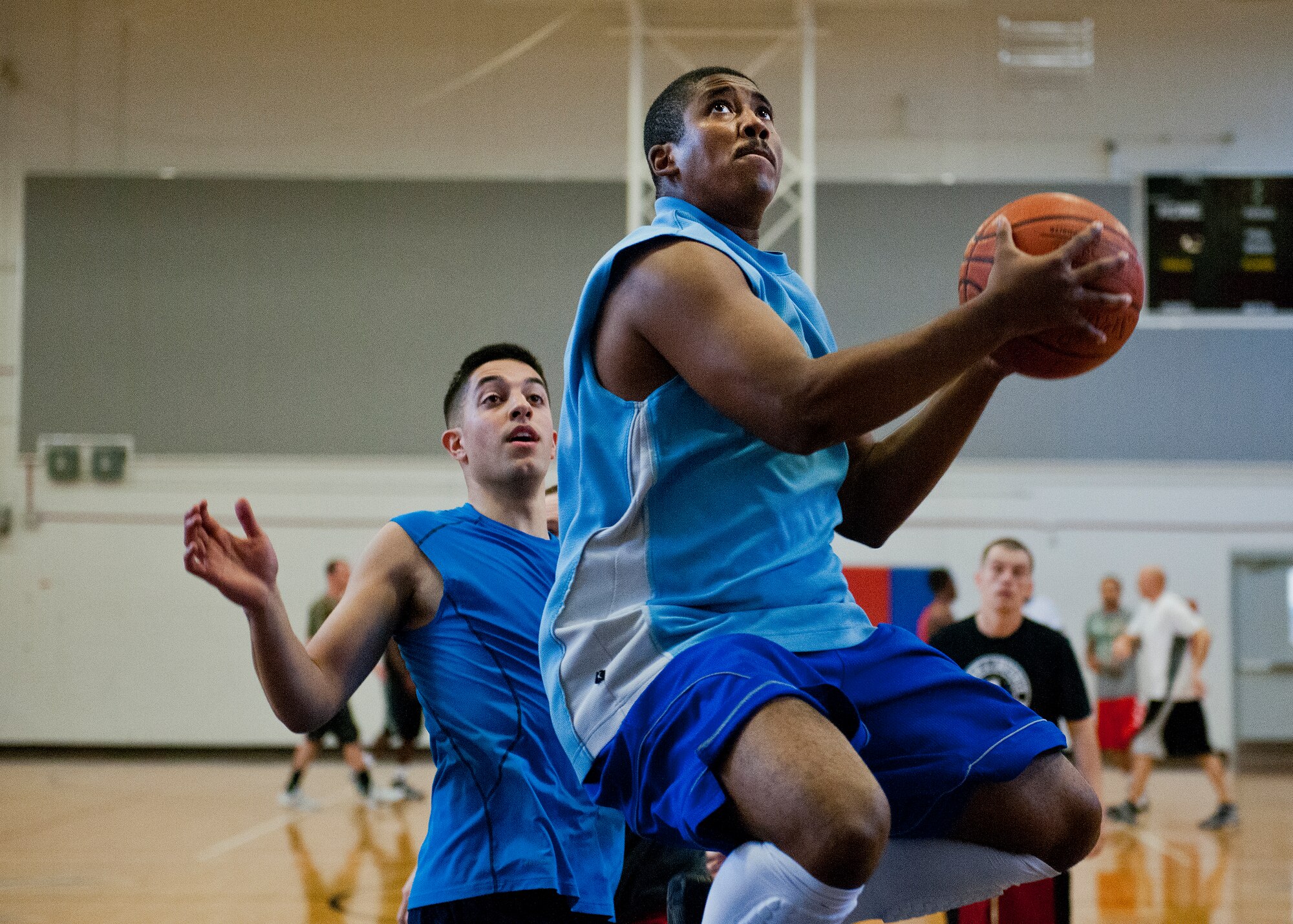 Jamal Johnson leaps for an undefended lay up during a three-on-three tournament held March 20 at Eglin Air Force Base, Fla. A variety of teams battled it out in the double elimination contest. (U.S. Air Force photo/Samuel King Jr.)