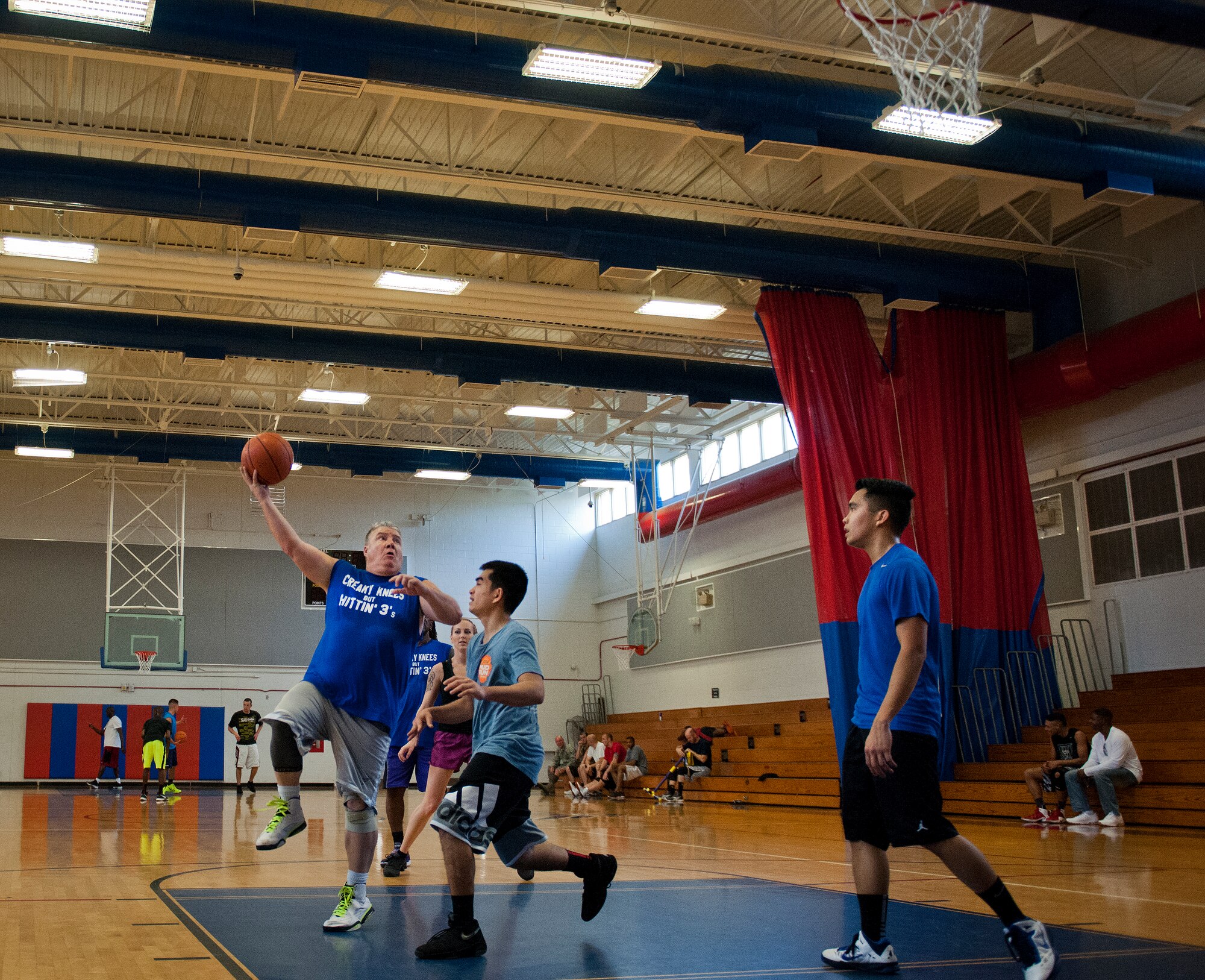 A competitor tries the “skyhook” during a three-on-three tournament held March 20 at Eglin Air Force Base, Fla. A variety of teams battled it out in the double elimination contest. (U.S. Air Force photo/Samuel King Jr.)