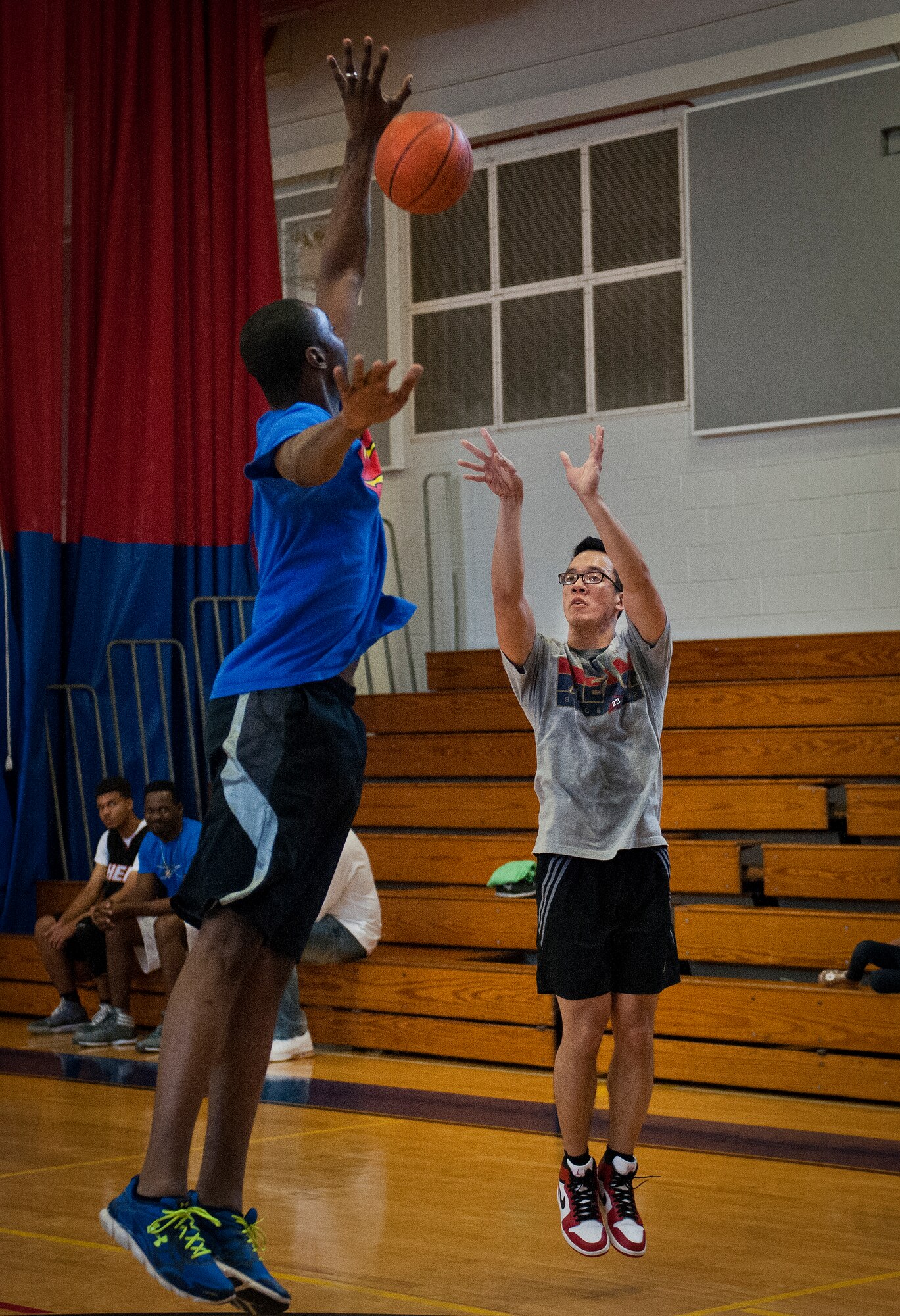 A competitor tries to swat a shooter’s three-point attempt during a three-on-three tournament held March 20 at Eglin Air Force Base, Fla. A variety of teams battled it out in the double elimination contest. (U.S. Air Force photo/Samuel King Jr.)
