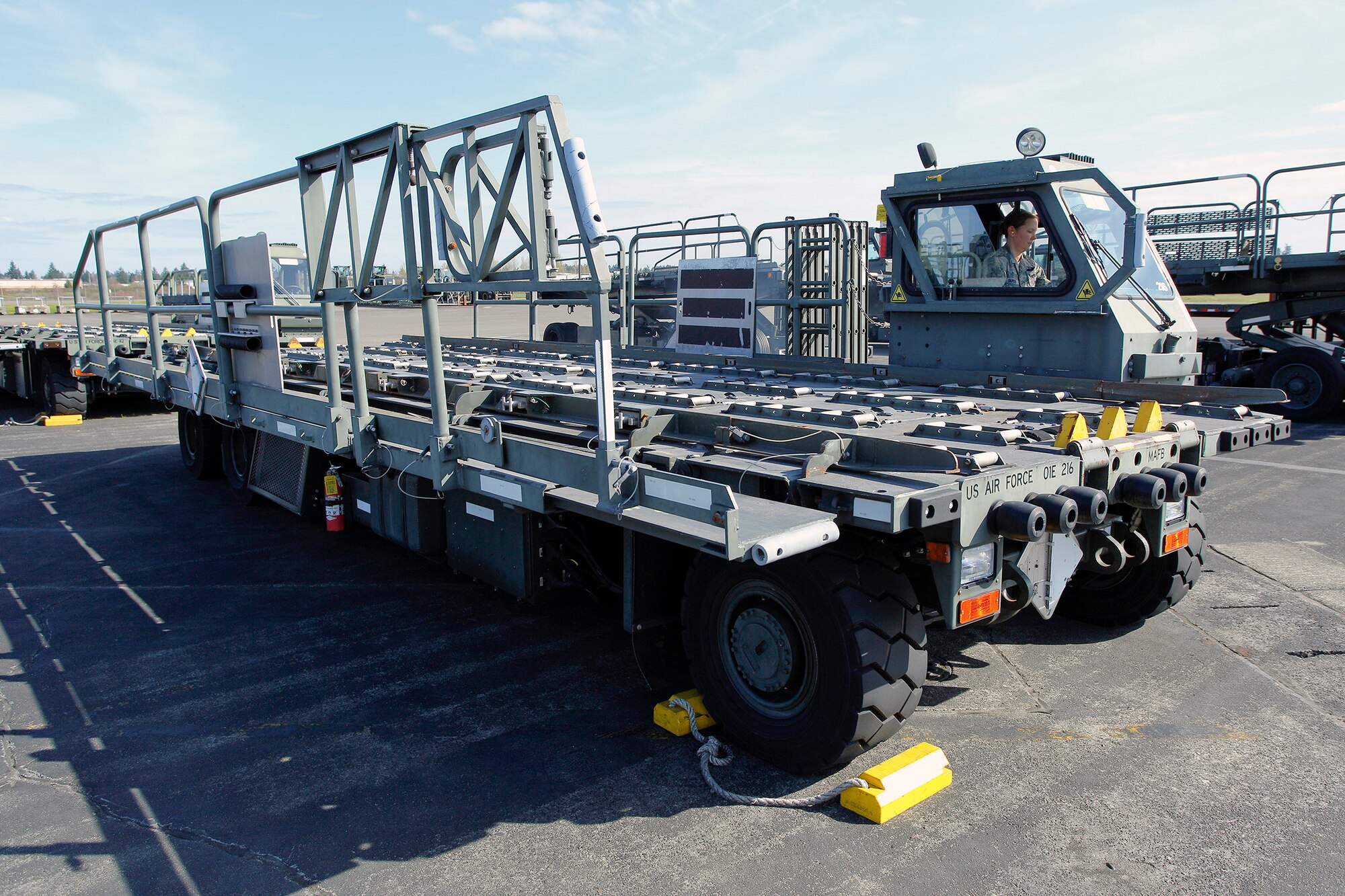 Tech. Sgt. Sarah Ourso, 86th Aerial Port Squadron load planner, out of Joint Base Lewis-McChord, Washington, puts in some on-the-job-training hours on the Halvorsen Loader, also known as a 25K loader March 27. The Halvorsen is a rapidly deployable, high-reach mechanized aircraft loader that can transport and lift up to 25,000 pounds of cargo and load it onto military and civilian aircraft. It's also one of the main vehicles used by aerial port specialists in theater. (U.S. Air Force Reserve photo by Jake Chappelle)