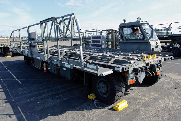Tech. Sgt. Sarah Ourso, 86th Aerial Port Squadron load planner, out of Joint Base Lewis-McChord, Washington, puts in some on-the-job-training hours on the Halvorsen Loader, also known as a 25K loader March 27. The Halvorsen is a rapidly deployable, high-reach mechanized aircraft loader that can transport and lift up to 25,000 pounds of cargo and load it onto military and civilian aircraft. It's also one of the main vehicles used by aerial port specialists in theater. (U.S. Air Force Reserve photo by Jake Chappelle)