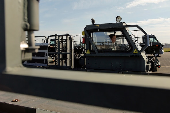 Tech. Sgt. Sarah Ourso, 86th Aerial Port Squadron load planner, out of Joint Base Lewis-McChord, Washington, puts in some on-the-job-training hours on the Halvorsen Loader, also known as a 25K loader March 27. The Halvorsen is a rapidly deployable, high-reach mechanized aircraft loader that can transport and lift up to 25,000 pounds of cargo and load it onto military and civilian aircraft. It's also one of the main vehicles used by aerial port specialists in theater. (U.S. Air Force Reserve photo by Jake Chappelle)
