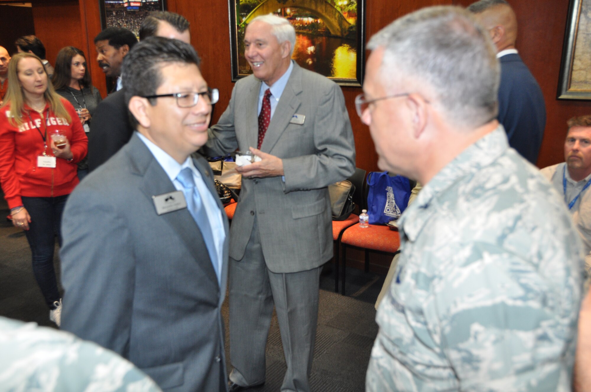 Greater San Antonio Chamber of Commerce, Richard Perez, President, and CEO (left) talks with Col. Randall L. Bright, commander 927th Air Refueling Wing during a welcoming social reception March 19, 2015 at the Chamber of Commerce in downtown San Antonio. “It’s our honor to come to San Antonio and thank you for making us feel welcome,” said Bright. (U.S. Air Force photo/Capt. Cresencio Medina)
