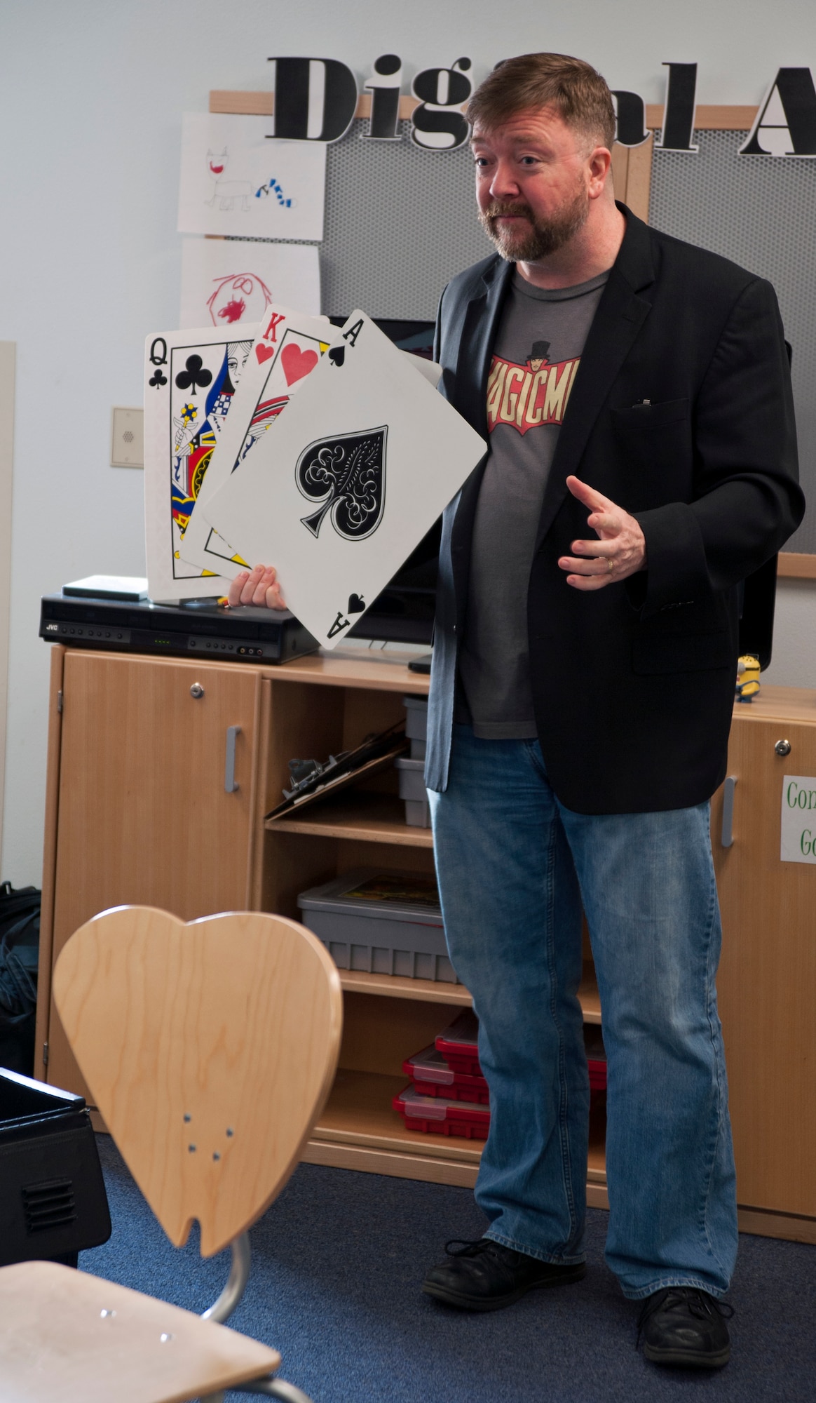 Richard Kennedy, 59th Signal Battalion information specialist and professional magician, teaches a magic class at the Illa School Age Program on Joint Base Elmendorf-Richardson, Alaska, March 20, 2015. Kennedy has been performing magic professionally for more than 30 years, traveling throughout the world. Kennedy is a native of Portland, Oregon. (U.S. Air Force photo/Airman 1st Class Tammie Ramsouer)