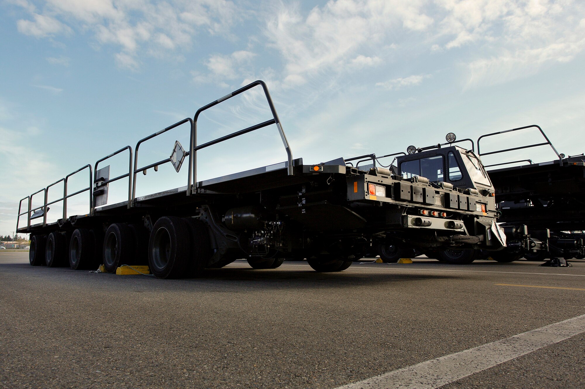 The Tunner 60K aircraft cargo loader-transporter is one of the main working vehicles used by aerial port specialists, in theater and at home station. It's a highly mobile vehicle system that can transport up to six pallets of cargo at 23 mph. Its deck elevates from 39 inches to 18.5 feet high and employs a powered conveyor system to move cargo. The deck has pitch, roll, yaw and side-to-side adjustment for quick, efficient interface with military and commercial cargo aircraft, including the C-17. The 446th Airlift Wing's 86th and 36th Aerial Port Squadrons at Joint Base Lewis-McChord, Washington are in the market for Air Transportation specialists. (U.S. Air Force Reserve photo by Jake Chappelle)