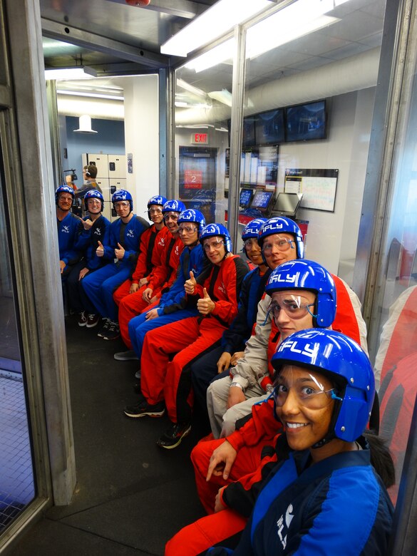 Twelve Airmen participate in an indoor sky diving activity March 20, 2015, in Denver as part of Single Airmen Initiative. The initiative was designed to provide resources that foster a strong culture, mission and sense of community for single Airmen, both enlisted and officer, as well as married Airmen whose spouses are deployed. (Courtesy photo)