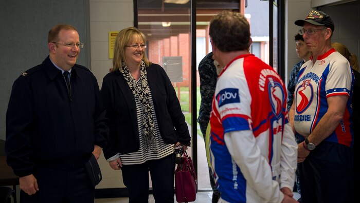 Col. Jeffrey DeVore, Joint Base Charleston commander and his wife, Michelle, talk with members of the Warrior Ride organization. The ride took place on March 27, 2015 and ended at the Reagan Center on Naval Weapons Station Charleston, S.C. The Warrior Ride is a non-profit organization with the mission of providing rehabilitation for wounded warriors by offering challenging adaptive bicycling and morale events throughout the United States. (U.S. Air Force photo/Airman 1st Class Clayton Cupit)