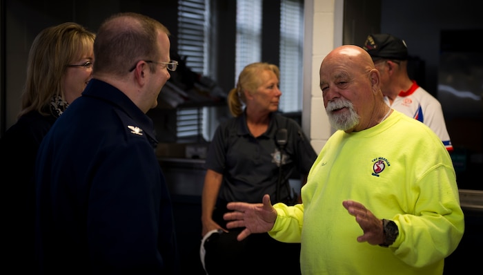 Bob Racine, co-founder of the Warrior Ride organization, talks with Col. Jeffrey DeVore, Joint Base Charleston commander and his wife, Michelle, about the goals and vision of the Warrior Ride. The ride took place on March 27, 2015 and ended at the Reagan Center on Naval Weapons Station Charleston, S.C. The Warrior Ride uses adaptive bicycling and other morale building events, such as kayaking and golf, as tools for recreation and rehabilitation for wounded warriors. (U.S. Air Force photo/Airman 1st Class Clayton Cupit)
