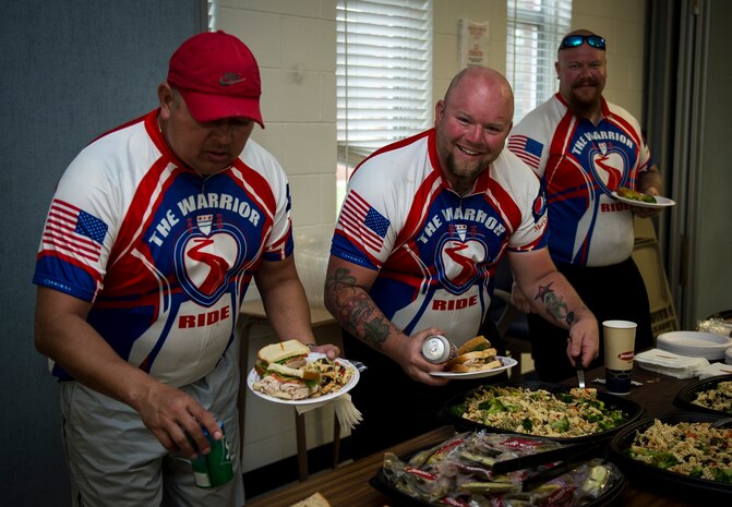 (left to right) Scott Hord, Dylan Hardwick and Greg Vinck, all Warrior Ride participants, enjoy a lunch March 27, 2015, at the Reagan Center on Naval Weapons Station Charleston, S.C. The Warrior Ride is a non-profit organization with the mission of providing rehabilitation for wounded warriors by offering challenging adaptive bicycling and morale events throughout the United States. (U.S. Air Force photo/Airman 1st Class Clayton Cupit)