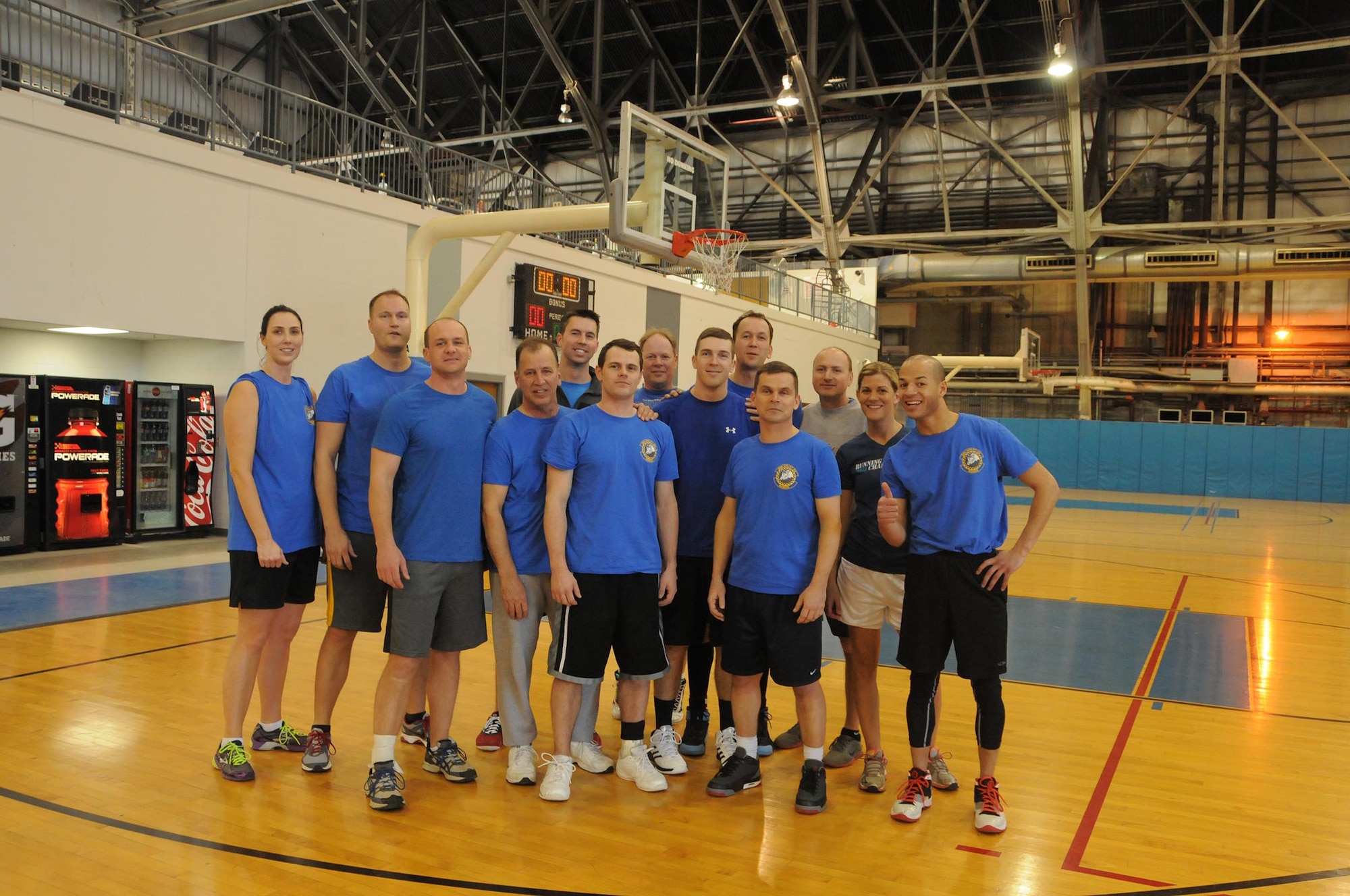 WRIGHT-PATTERSON AIR FORCE BASE, Ohio – 89th Airlift Squadron basketball team members pose for a photo after winning the 445th Airlift Wing Battle of the Squadrons, 2015 March Madness Basketball Tournament championship game against the 445th Logistics Readiness Squadron at the Wright Field Fitness Center, Wright-Patterson Air Force Base, Ohio, March 7, 2015.  The game was sponsored by the 445th Force Support Squadron Services Flight as a morale building event. (U.S. Air Force Photo/Tech. Sgt. Anthony G. Springer)