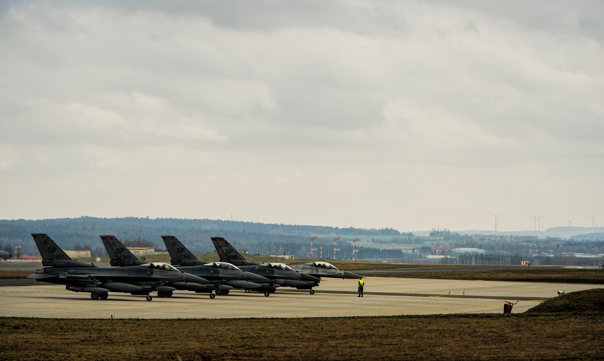 Four F-16 Fighting Falcon fighter aircraft assigned to the 480th Fighter Squadron prepare to taxi to their hardened aircraft shelters March, 27, 2015, at Spangdahlem Air Base, Germany. The squadron participated in exercise Dacian Warhawk 2015, in Romania with the Romanian air force. The exercise aimed to strengthen the NATO partners’ interoperability and their readiness to conduct future combined air operations. (U.S. Air Force photo by Staff Sgt. Christopher Ruano)
