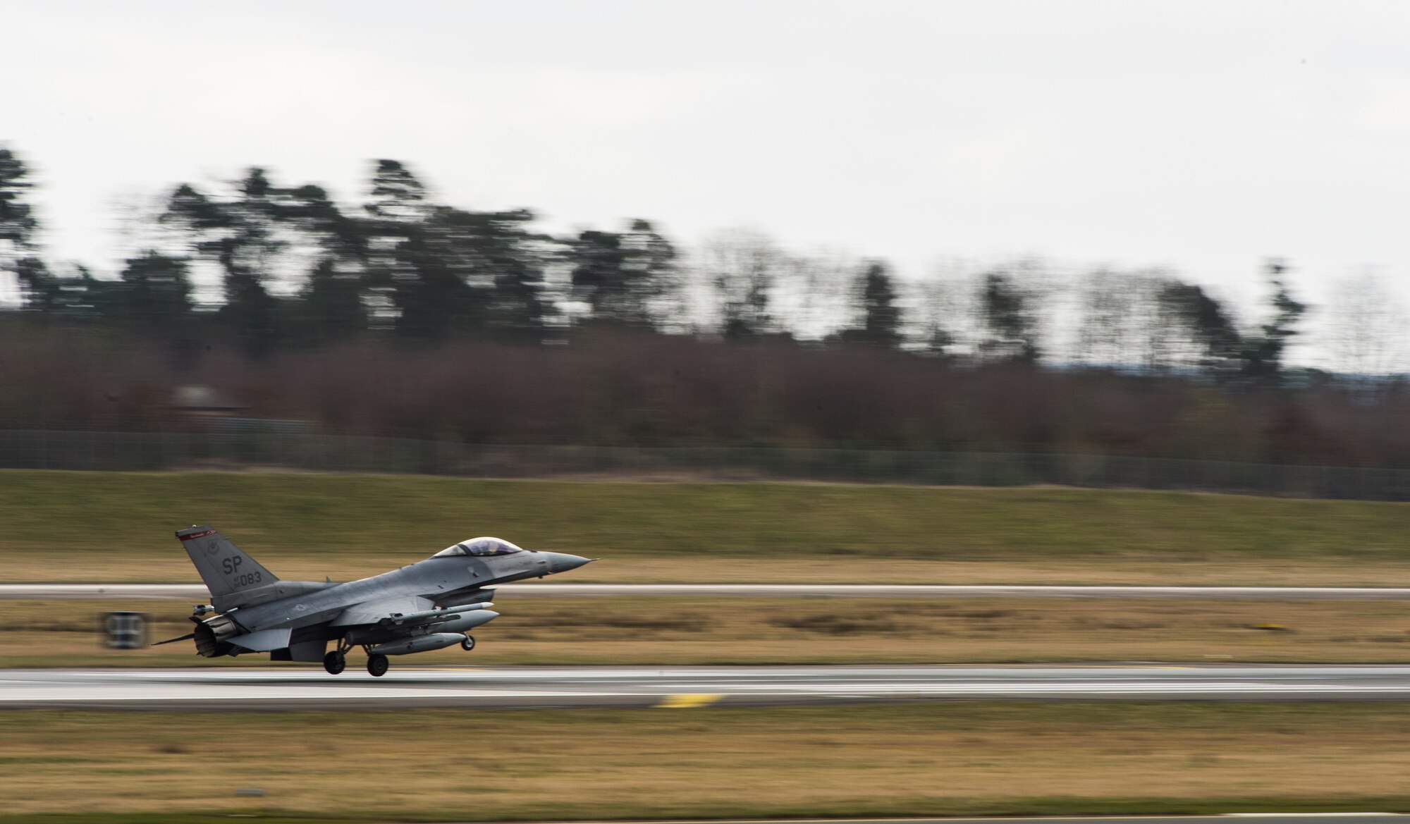 An F-16 Fighting Falcon fighter aircraft assigned to the 480th Fighter Squadron lands on the flightline at Spangdahlem Air Base, Germany, Feb. 13, 2015. The six aircraft participated in exercise Dacian Warhawk 2015, in Campii Turzii, Romania, strengthening interoperability between U.S. and Romanian air forces. (U.S. Air Force photo by Staff Sgt. Christopher Ruano)