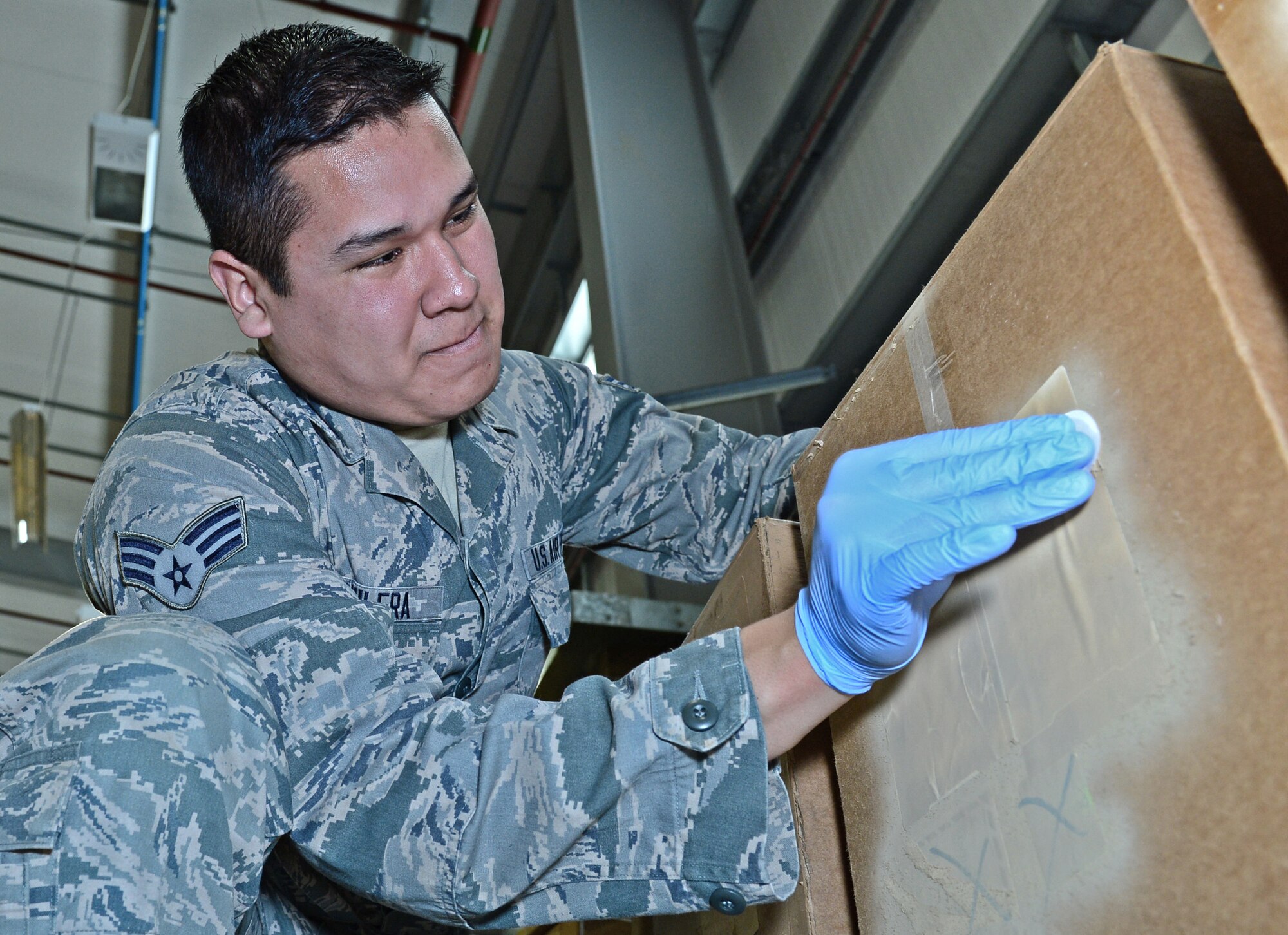 Senior Airman Antonio Aguilera, 48th Operations Support Squadron assistant bioenvironmental engineering technician, performs a radiation test to sample for any leaks or radiation sources on a shipment at Royal Air Force Lakenheath, England, March 23, 2015. Aguilera was nominated for a Liberty Spotlight because he embodies the core value of Excellence In All We Do. (U.S. Air Force photo by Airman 1st Class Erin R. Babis/Released)