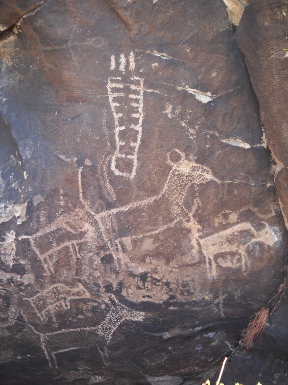 These archaic anthropomorphic (top left) and representational protohistoric (buffalo and cattle) pecked petroglyphs at John Martin Reservoir, Colorado, may date from approximately 5000 B.C. to about 1880 A.D.  Petroglyph panels and other cultural resources located on public lands belong to all Americans and are protected by the National Historic Preservation Act.  Please photograph but do not touch or deface these historic properties.  