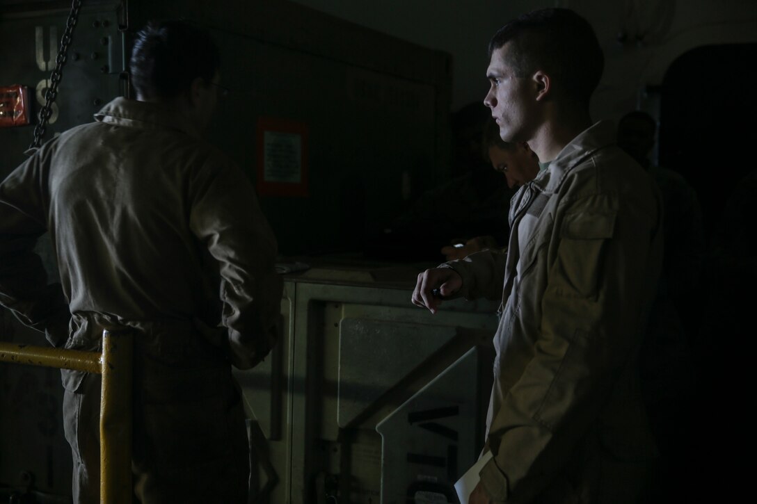 Combat cargo Marines with the 15th Marine Expeditionary Unit prepare to load Marines onto a landing craft, air cushion for an amphibious raid during Composite Training Unit Exercise (COMPTUEX) off the coast of San Diego, March 27, 2015. These Marines ensure all personnel and gear get where they need to go. (U.S. Marine Corps photo by Cpl. Anna Albrecht/Released)