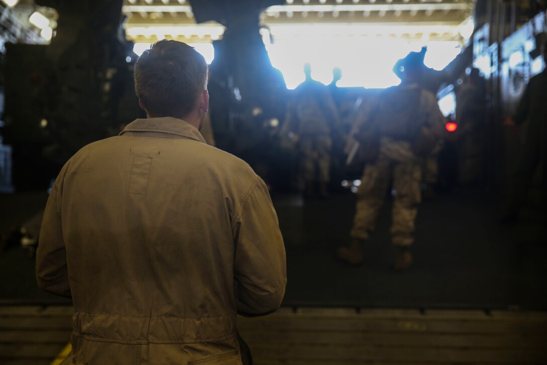 A U.S. Marine assigned to the Combat Cargo Department aboard the USS Essex (LHD-2) ensures everyone on his manifest is loaded onto a landing craft, air cushion during Composite Training Unit Exercise (COMPTUEX) off the coast of San Deigo, March 27, 2015. Every person who arrives or departs the ship goes through combat cargo so they have full accountability of all personnel and cargo aboard the ship. (U.S. Marine Corps photo by Cpl. Anna Albrecht/Released)