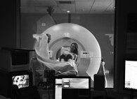 Frankie Perez, West Texas Medical Associates Radiology MRI technologist, helps Master Sgt. Amy C. Dotson, 316th Training Squadron instructor, after an MRI at the WTMA, March 16, 2015. Dotson received the MRI to check on the progression of the multiple sclerosis she has. (U.S. Air Force photo by Senior Airman Joshua D. Edwards)