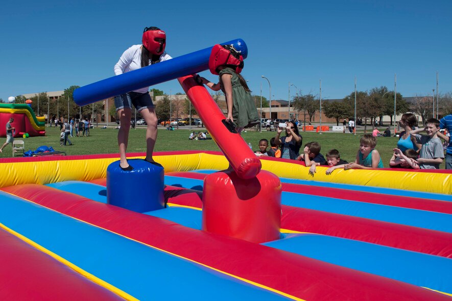 U.S. Army Texas National Guard Staff Sgt. Laurie Gutierrez, 149th Human Recourse Company and native of San Antonio, jousts with her five-year-old daughter, Viviana Marrero, at the Sheppard Air Force Base, Texas, Spring Picnic March 28, 2015. The picnic was hosted by the 82nd Force Support Squadron and is the second picnic to take place at Sheppard. (U.S. Air Force photo by Senior Airman Kyle Gese)