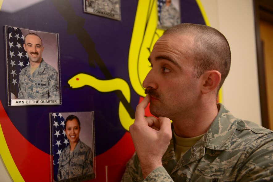 Senior Airman David Letteer, 51st Aerospace Medicine Squadron nutritional medicine technician, reflects on growing his mustache March 26, 2014, at Osan Air Base, Republic of Korea. Letteer nicknamed his mustache Vitamin M. (U.S. Air Force photo by Senior Airman David Owsianka)