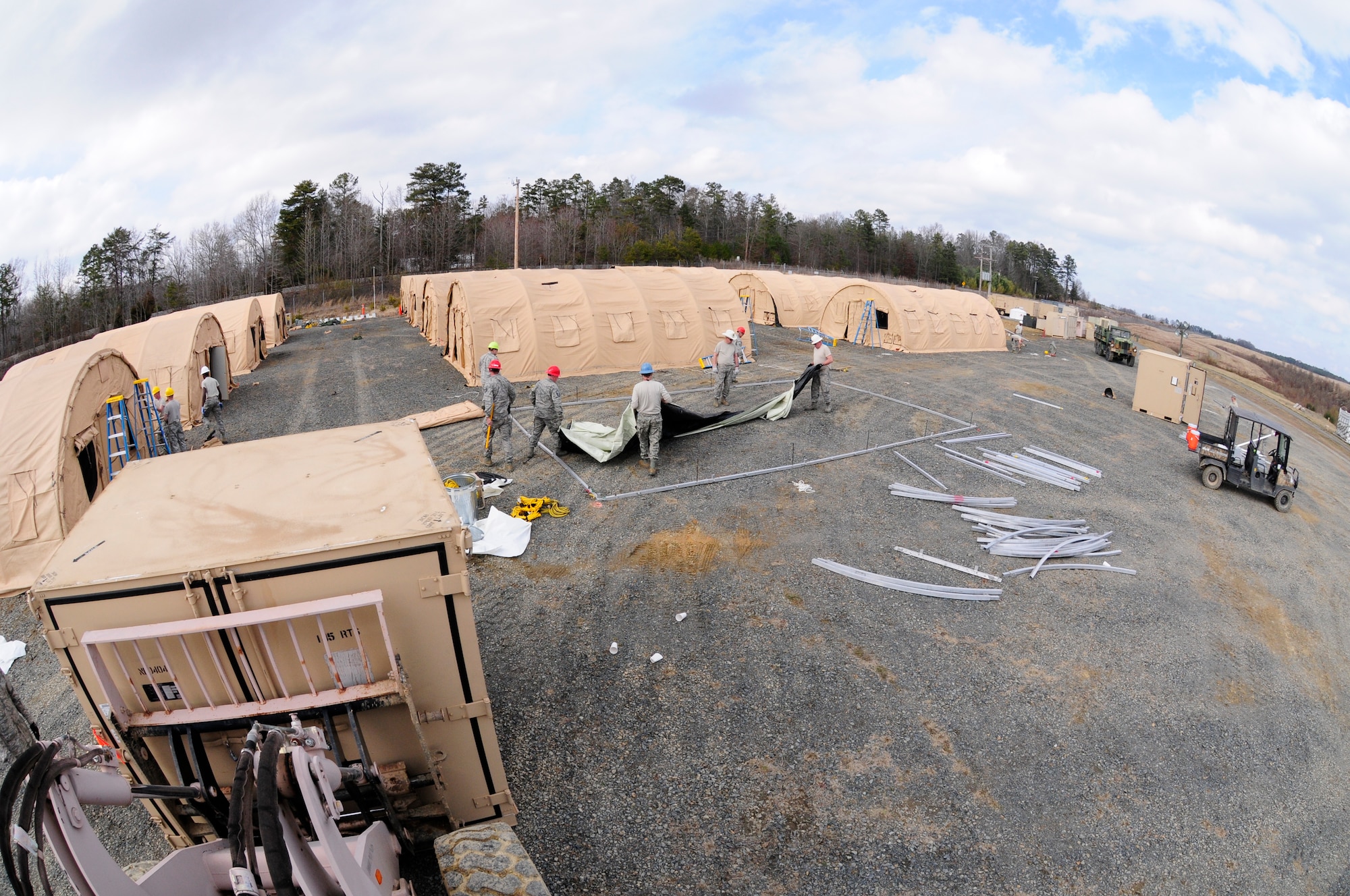 Members from the U.S. Air National Guard, 145th Civil Engineer Squadron, install 16 Alaskan Small Shelter Systems at the 145th CES-Regional Training Site, New London, N.C. to provide lodging for over 200 personnel participating in Vigilant Guard 2015, March 6-8, 2015. Vigilant Guard 2015 is an exercise that provides an opportunity for Army and Air National Guard, North Carolina Emergency Management and county civilian partners to come together to train as true partners in order to respond effectively to natural disasters. (U.S. Air National Guard photo by Master Sgt. Patricia F. Moran, 145th Public Affairs/Released)