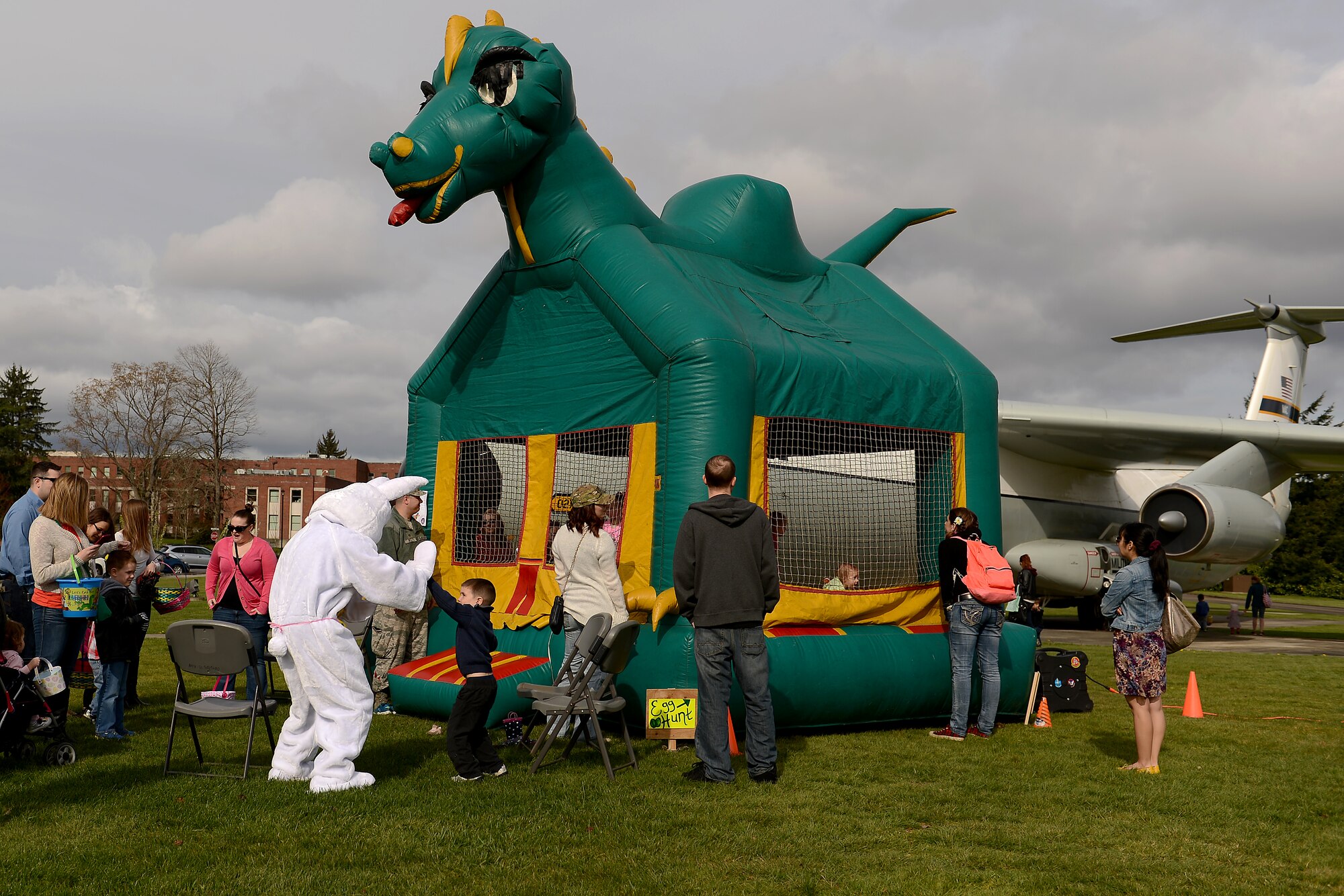 Joint Base Lewis-McChord families enjoy the McChord 5/6 Club’s Annual East Egg Hunt, March 28, 2015. The event had Easter egg hunts for different age groups, a bouncy castle, a photo booth, and several other activities for children. (U.S. Air Force photo/ Staff Sgt. Tim Chacon)