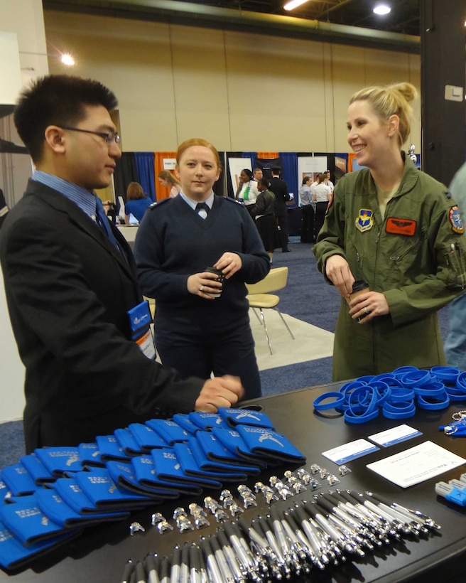 U.S. Air Force Capt. Deanna Franzen, 344th Recruiting Squadron support flight commander and Capt. Tonya Hansen, T-6 Texan II instructor pilot in the 80th Flying 
Training Wing at Sheppard talk to a potential recruit at the International 
Women in Aviation Conference in Dallas March 7. Team Sheppard and Air Force 
Recruiting Service are exploring new ways Air Force bases and local recruiters 
can work together. (2nd Lt Ava Margerison/ Released)
