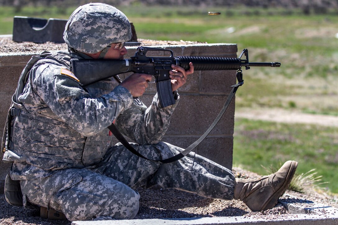 Army Staff Sgt. David Calderon qualifies with his personal weapon immediately after completing a grueling 10-mile road march during the 2015 Best Warrior and Drill Sergeant of the Year Competition on Fort Huachuca, AZ., March 26, 2015. Calderon is assigned to the 98th Training Division.