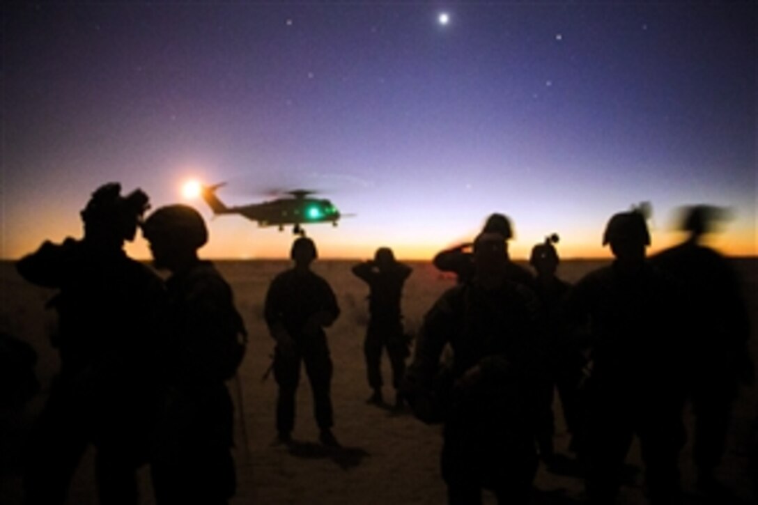 Marines attending the infantry officers course conduct fast rope training in preparation for Talon Reach during Weapons and Tactics Instructor Course on Auxiliary Airfield 2 near Yuma, Ariz., March 26, 2015. The training is hosted by Marine Aviation Weapons and Tactics Squadron One cadre, and provides standardized tactical training and certification of unit instructor qualifications to support Marine aviation Training and Readiness.