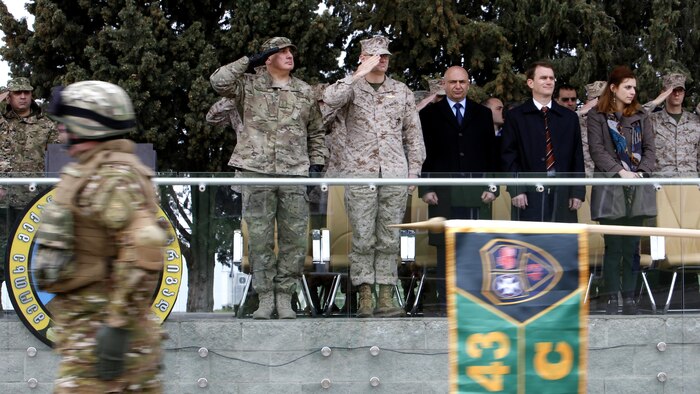 Georgian soldiers and U.S. Marines perform a ceremonial departure in front of their leaders, Maj. Gen. Vakhtang Kapanadze, Chief of Defense of Georgian Armed Forces, and Brig. Gen. Norma L. Cooling, deputy commander of U.S. Marine Corps Forces Europe and Africa, during a ceremony, March 24 in Vaziani Training Area. The Georgian 43 rd Light Infantry Battalion and U.S. Marines, who have worked together since October as part of the Georgia Deployment Program, will contribute to NATO’s Resolute Support in Afghanistan.