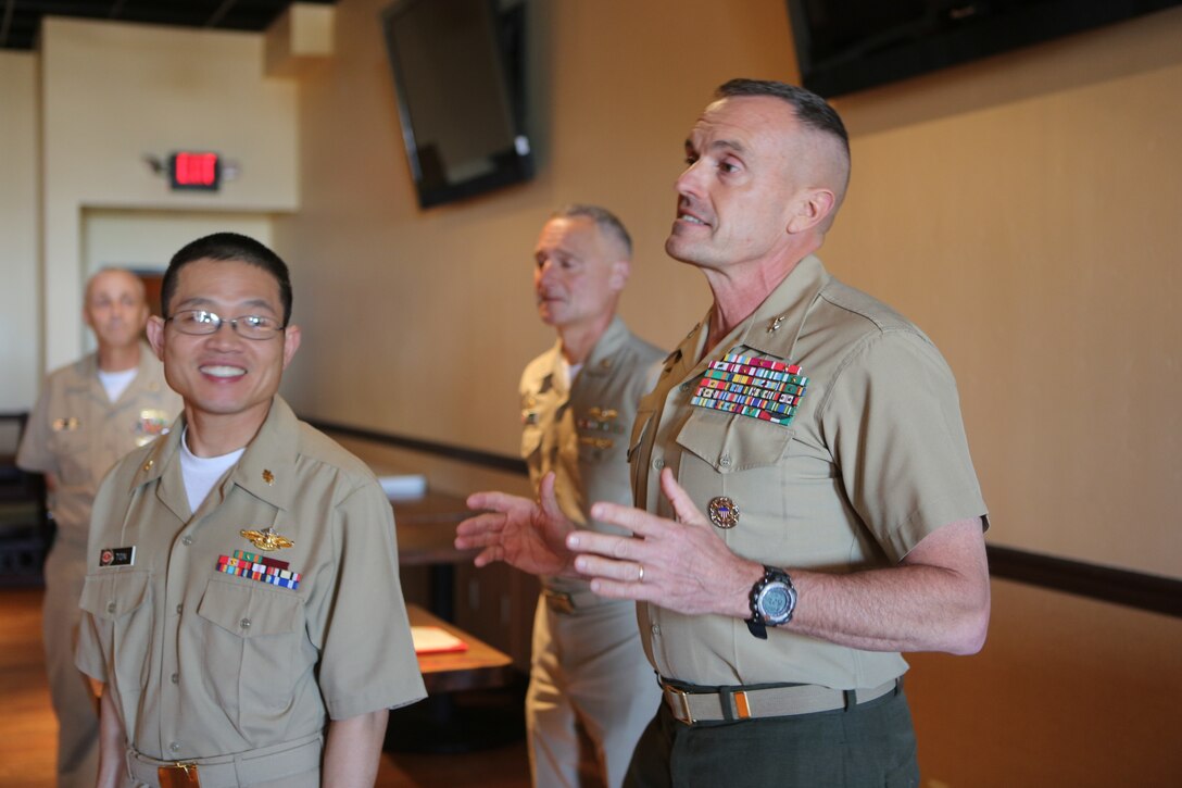 Maj. Gen. Vincent A. Coglianese, commanding general for 1st Marine Logistics Group, speaks during an award ceremony for Lt. Cmdr. Vinh T. Ton, dentist for 1st Dental Battalion, at Pacific Views Event Center aboard Camp Pendleton, Calif, March 27, 2015. The Weedon E. Osborne award is earned by a dental officer who makes significant contributions to operational readiness. It is presented annually by the Marine Corps Association. The award is named in honor of Lt. j.g. Weedon E. Osborne, Dental Corps, U.S. Navy, who was killed in action during the battle of Belleau Wood in France in 1918. “When I reflect upon the pool of other extraordinarily dedicated and talented practitioners nominated for this award, words cannot express the depth of my humility for having been chosen for this honor,” said Ton. “I would like to share the honor of this award with all those who were also nominated, truly any of you could have been selected for this award.”