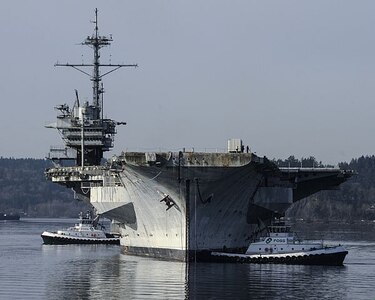 150305-N-KR207-029 BERMERTON, Wash. (March 5, 2015) The decommissioned Forrestal-class aircraft carrier ex-USS Ranger (CV 61) is towed away from Naval Base Kitsap-Bremerton. Ranger is being towed to Brownsville, Texas, for dismantling.