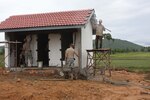 Soldiers from Utah National Guard's 197th Special Troops Company (Airborne)and the Royal Cambodian Armed Forces work together to complete the restrooms at the school as part of the humanitarian civic assistance project for Angkor Sentinel 2010.
