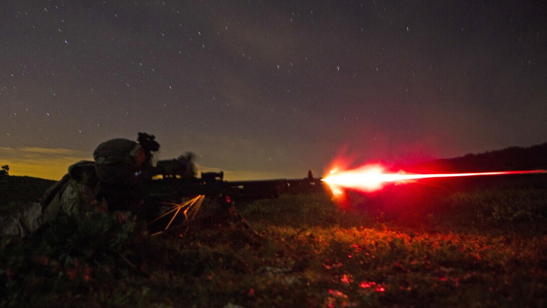 U.S. Marine Corps Lance Cpl. Charles Detz III, a machine-gunner with Special-Purpose Marine Air-Ground Task Force Crisis Response-Africa, fires a tracer round from an M240B during a live-fire training exercise in Sierra Del Retin, Spain, March 24, 2015. Marines stationed at Moron Air Base utilized the Spanish training facility to conduct a variety of training missions to maintain their infantryman skills.