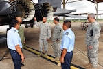 Chief Master Sgt. Donnie Dunn, ground safety manager with the Louisiana National Guard’s 159th Fighter Wing, describes how to inspect an augmenter nozzle on an F-15 Fighter aircraft to members of the Belize Defence Force during a State Partnership Program visit on July 8, 2010.