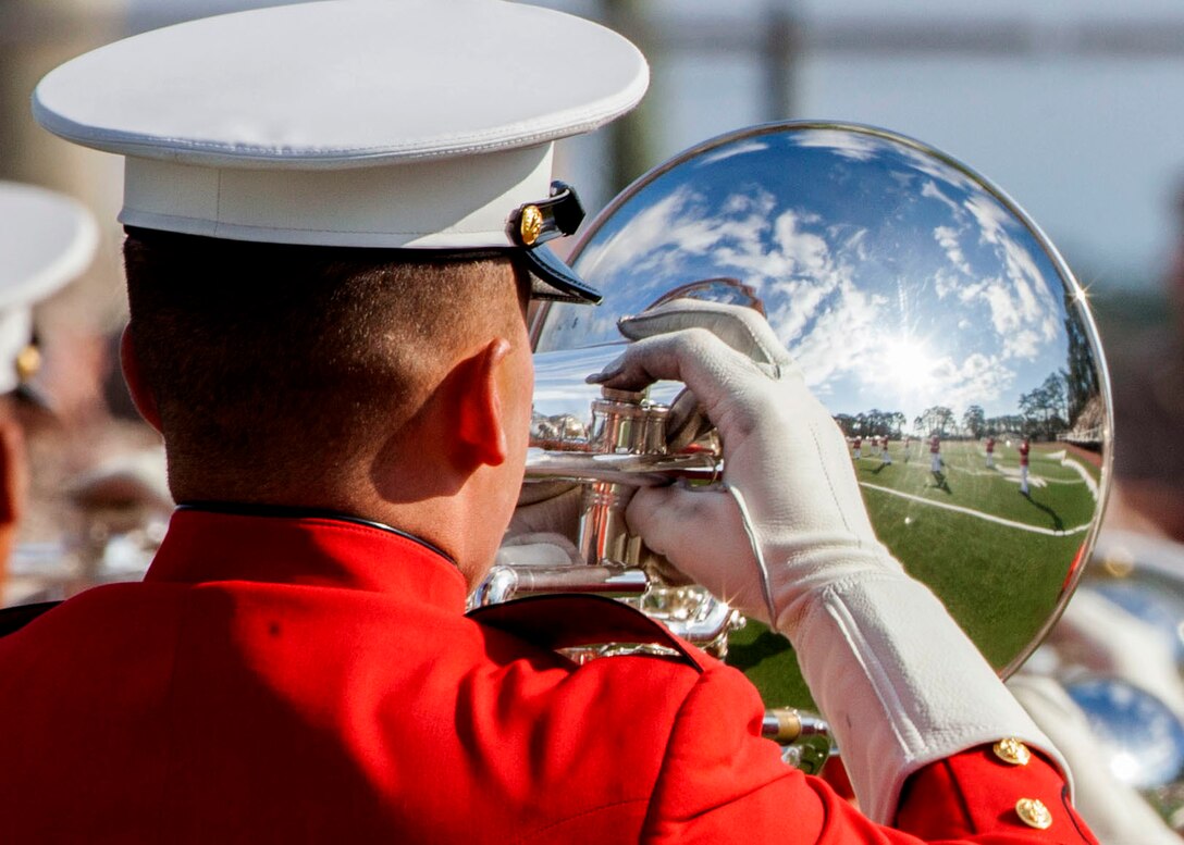 The U.S. Marine Drum and Bugle Corps performs during a Battle Color Ceremony at Liversedge Field, Camp Lejeune, N.C., March 24, 2015. The ceremony featured the Drum and Bugle Corps, the Silent Drill Platoon and the Marine Corps Color Guard. (U.S. Marine Corps photo by Lance Cpl. Jacqueline R. Smith, MCI-East Combat Camera/Released)