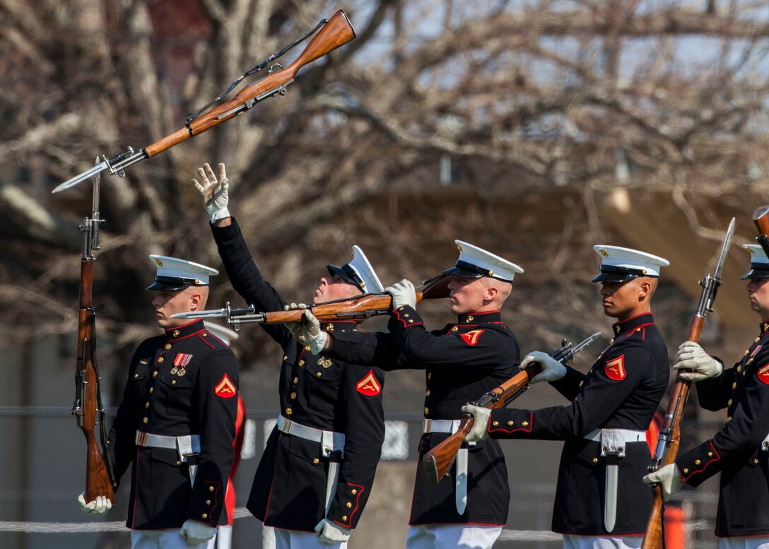 The U.S. Marine Corps Silent Drill Platoon executes rifle spins with M1 Garand rifles during a Battle Color Ceremony at Liversedge Field, Camp Lejeune, N.C., March 24, 2015. The ceremony featured the Drum and Bugle Corps, the Silent Drill Platoon and the Marine Corps Color Guard. (U.S. Marine Corps photo by Sgt. Christopher Q. Stone, MCI-East Combat Camera/Released)