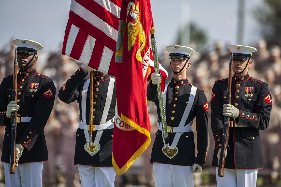 The U.S. Marine Corps Color Guard presents the official Battle Colors of the Marine Corps during a Battle Color Ceremony at Liversedge Field, Camp Lejeune, N.C., March 24, 2015. The ceremony featured the Drum and Bugle Corps, the Silent Drill Platoon and the Marine Corps Color Guard. (U.S. Marine Corps photo by Sgt. Christopher Q. Stone, MCI-East Combat Camera/Released)