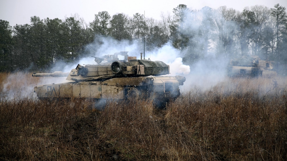Two M1A1 Abrams with 2nd Tank Battalion, 2nd Marine Division underwent a CS-gas attack during a Marine Corps Combat Readiness Evaluation held at Fort Pickett, Virginia, March 25-28, 2015. Marines with the battalion were evaluated on different scenarios during the MCCRE, which included tactical road marches, bounding through a field in tanks while engaging potential threats, and shooting at a range designed for platoon gunnery qualification.