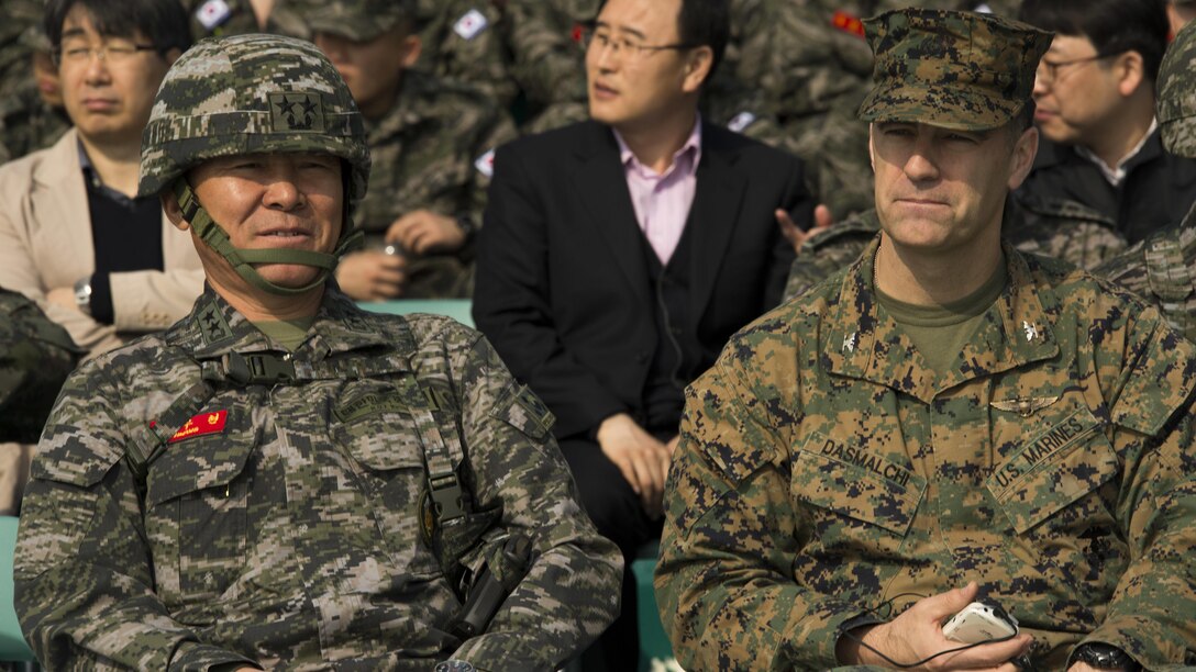 Republic of Korea Maj. Gen. Woo Hyun Hwang, Commanding General, 1st Marine Division, and U.S. Marine Corps Col. Romin Dasmalchi, Commanding Officer, 31st Marine Expeditionary Unit, watch a combined amphibious landing at Pohang, South Korea, March 30, 2015. The Korean Marine Exchange Program demonstrates the unique ability of the 31st MEU to arrive in theater via amphibious shipping along with a ROK Regimental Landing Team to form an amphibious Combined Marine Expeditionary Brigade. KMEPs are annual combined exercise conducted by U.S. Marine and Navy Forces with the ROK in order to strengthen working relationships across the range of military operations – from disaster relief to complex, expeditionary operations. 