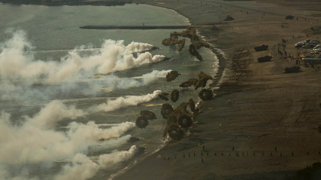 Republic of Korea and U.S. Marine Corps amphibious assault vehicles use smoke screens during a beach raid during a combined amphibious landing at Pohang, South Korea, March 30, 2015. The Korean Marine Exchange Program demonstrates the unique ability of the 31st Marine Expeditionary Unit to arrive in theater via amphibious shipping, along with ROK Regimental Landing Team to form an amphibious Combined Marine Expeditionary  Brigade. KMEPs are annual combined exercise conducted by U.S. Marine and Navy Forces with the ROK in order to strengthen working relationships acress the range of military operations - from disaster relief to complex, expeditionary operations. 