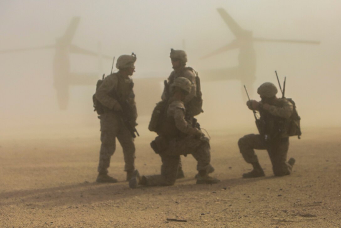 U.S. Marines with 2nd Battalion, 7th Marine Regiment, Special Purpose Marine Air Ground Task Force – Crisis Response – Central Command, prepare to locate a simulated down pilot after exiting an MV-22 Osprey tiltrotor aircraft during a Tactical Recovery of Aircraft and Personnel drill in the Central Command area of operation, March 8, 2015. TRAP missions are conducted by teams of Marines and sailors to rescue or extract downed personnel or aircraft in the event of an in-flight emergency during combat operations. (U.S. Marine Corps photo by Cpl. Tony Simmons/Released)
