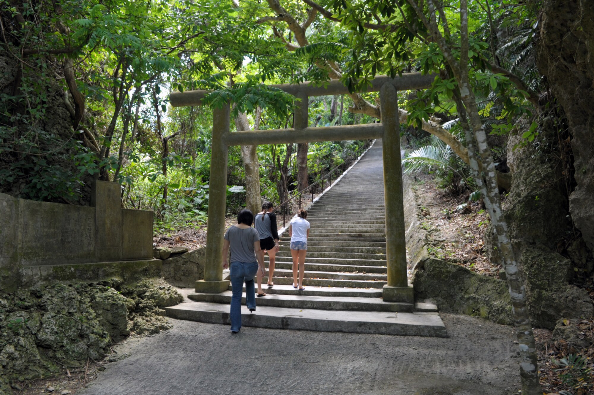Visitors pass through a “torii” gate and begin the climb up a set of stairs to the Shirumichu sacred cave on Hamahiga Island on March 28, 2015. The cave, believed to be the dwelling place of the gods who created the Okinawan islands, is only about a 25-minute drive from Kadena Air Base, Japan
