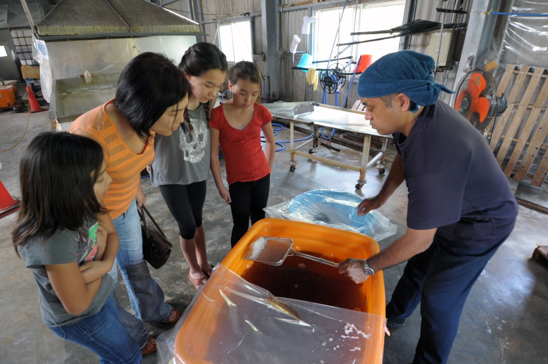 Masaru Takaesu explains the process for harvesting salt at his factory on Hamahiga Island during a March 22, 2015, tour. Hamahiga Island, about a 25-minute drive from Kadena Air Base, Japan, offers a couple of free sightseeing locations, including the Takaesu Salt Factor. (U.S. Air Force photo by Tim Flack)