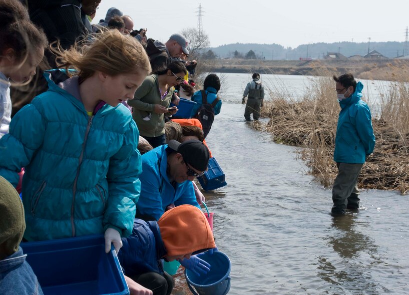 Members of Misawa Air Base and the local community gather at the Oirase River during the 18th Annual Baby Salmon Release March 28, 2015. More than 400 members of Misawa Air Base and the local community participated in the bilateral event which was held in conjunction with Earth Day. (U.S. Air Force photo by Airman 1st Class Jordyn Rucker/Released)